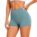 Pantalón corto deportivo de mujer talla S en tejido elástico verde azulado de cintura alta