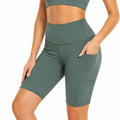 Pantalón corto deportivo S de tejido elástico verde oscuro - cintura alta con bolsillo lateral